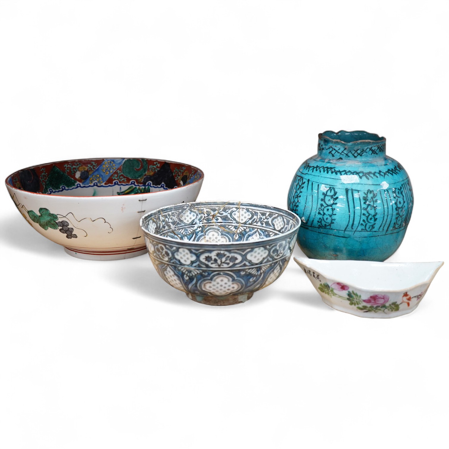 An early Persian pottery bowl and vase, a Japanese bowl and another Chinese segment dish, tallest 20cm